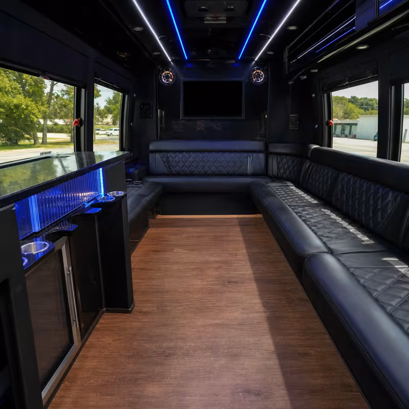 Friends laughing during a Memphis party bus celebration
