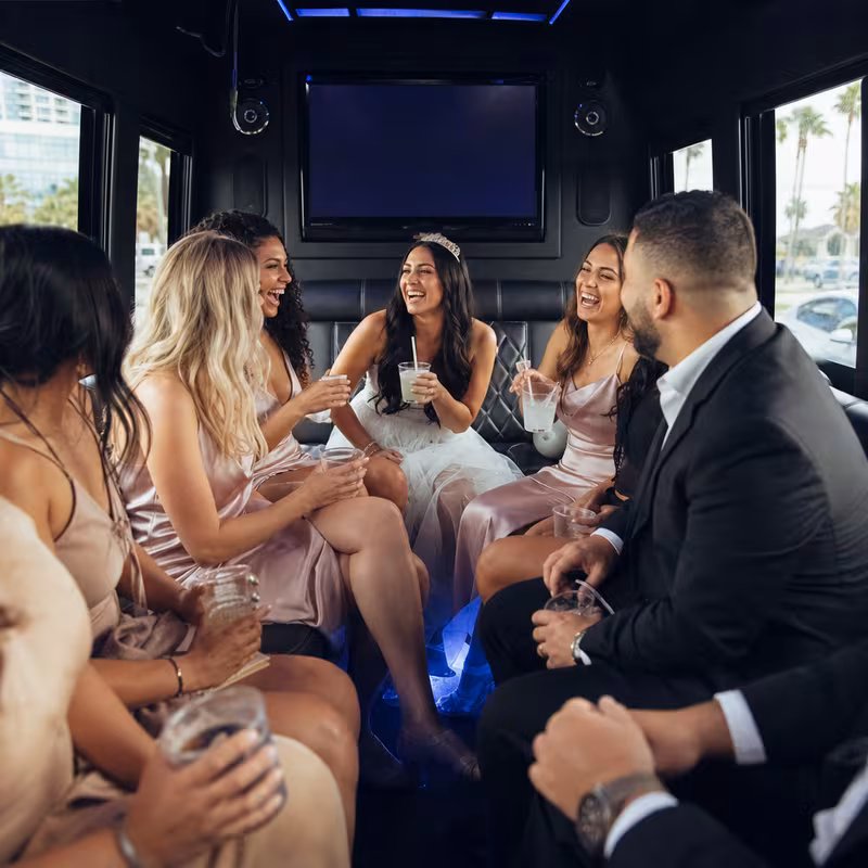 Party bus interior with wraparound leather seating and LED lighting in Memphis
