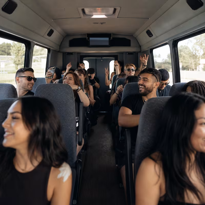 Party bus interior with wraparound leather seating and LED lighting in Memphis