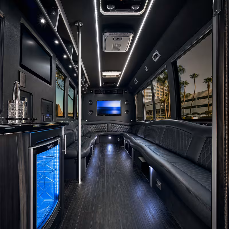 Party bus interior with wraparound leather seating and LED lighting in Memphis