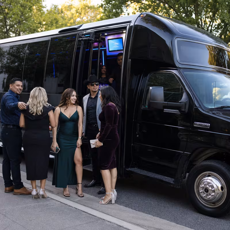 Passengers loading luggage while boarding an Memphis group shuttle