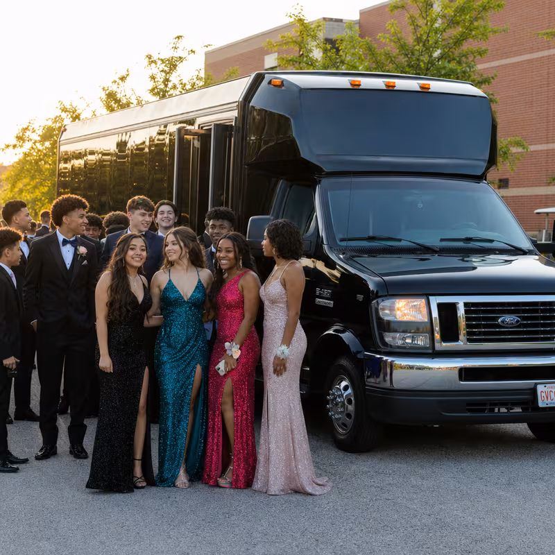 Group boarding a white charter bus for Prom & Homecoming Transportation transportation in Memphis