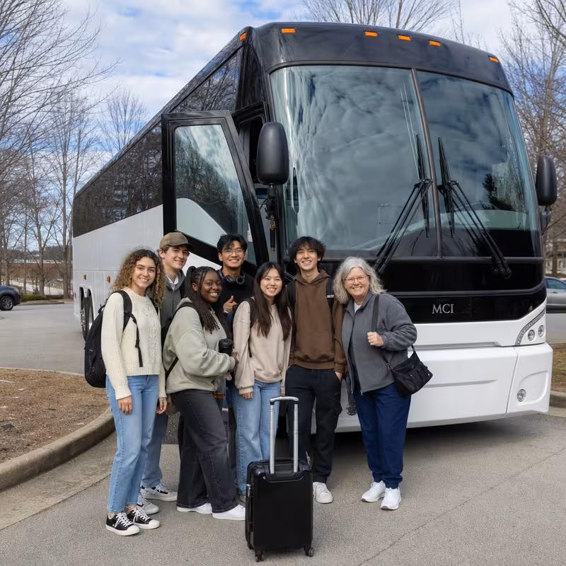 Passengers loading luggage while boarding an Memphis group shuttle