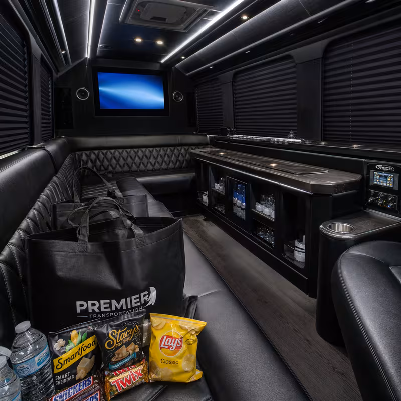 Party bus interior with wraparound leather seating and LED lighting in Memphis